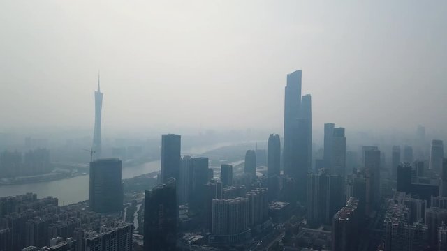 Guangzhou, China. Aerial shot of downtown of city with Canton tower and Central Buildings District on a foggy day