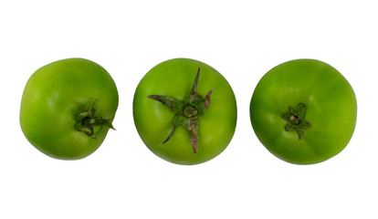 Three green tomatoes isolated on white background