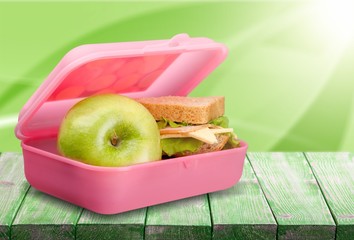 Lunchbox with an apple isolated on background