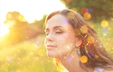 Portrait of young cute woman on nature background