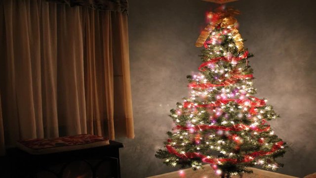 Glowing Christas tree lights in the background. Background video. Christmas spirit and holidays time.