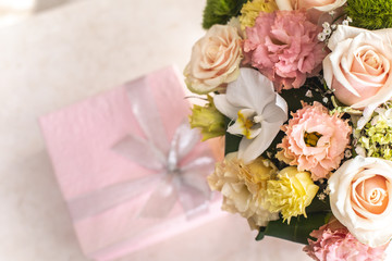 Close up of wonderful bouquet of flowers and little rose giftwrap