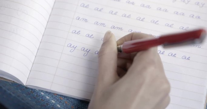 Close up,  Writing on a workbook &ndash; Calligraphy practice &ndash; 4k