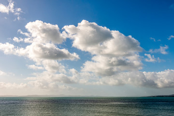 Naklejka na ściany i meble Cloudy sky over Hauraki Gulf, New Zealand