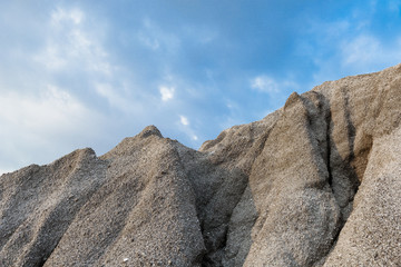 A rocky mountain or pile of fine white stone, which was mined from the mining process