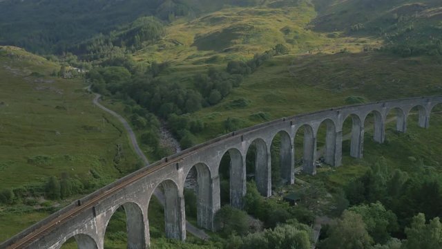 Aerial view of couple by Glenfinnan railway Viaduct Scotland