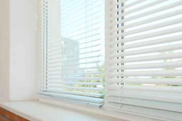New modern window with blinds indoors. Home interior - obrazy, fototapety, plakaty
