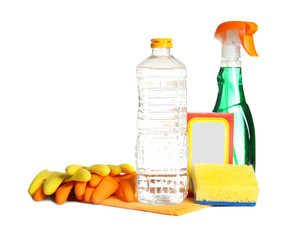 Composition with vinegar and cleaning supplies on white background