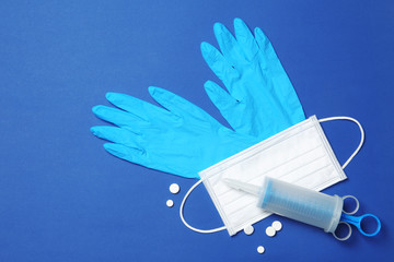 Flat lay composition with medical gloves on color background