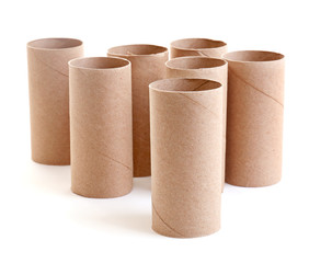 Empty paper toilet rolls on white background