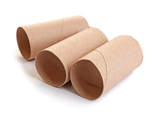 Empty paper toilet rolls on white background
