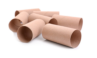 Empty paper toilet rolls on white background