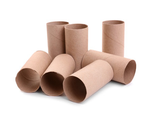 Empty paper toilet rolls on white background