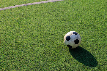 Plakat Football on artificial turf. It is for green background in a stadium