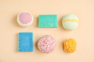 Flat lay composition with bath bombs and soap bars on color background