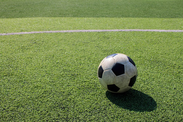 Football on artificial turf. It is for green background in a stadium