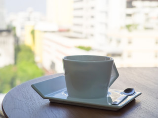 hot coffee cup on wood table, hot chocolate milk in the morning.