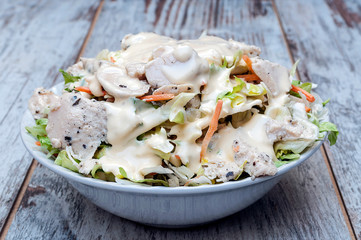 Salad surrounded by rustic background
