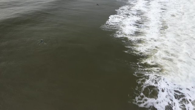Big waves break at the coast of Belmar, New Jersey.