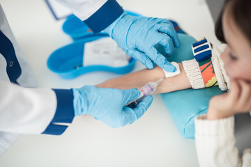 Professional laboratory investigations in healthcare system. Top view portrait of female child in...