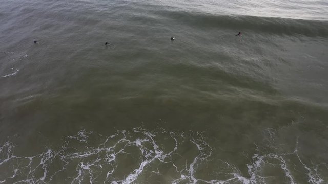 Surfers waiting for the next wave to catch.