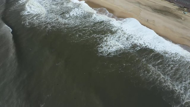 Drone shot of waves hitting the beach in Belmar.