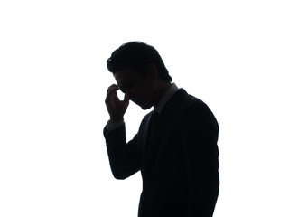 頭をかかえるビジネスマン