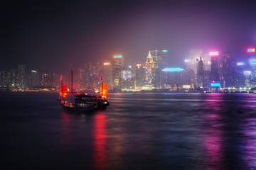 Misty Hong Kong:  Victoria Harbor at night.     
