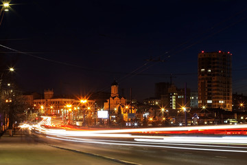Fototapeta na wymiar night Avenue with cars at speed