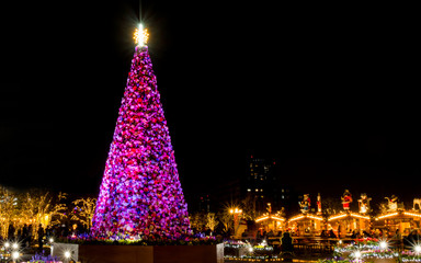 A display of a huge Christmas tree at night background