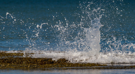 Water breaking over rocks with a splash