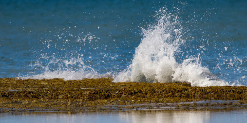 Water breaking over rocks with a splash