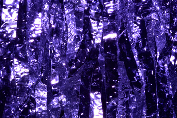 Plastic sheet metal shiny.When light hits, it will reflect. Put together a beautiful backdrop. Feel like a purple metal curtain.