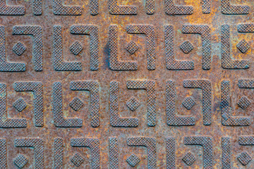 Steel sheet with pattern notches - gray vintage metal abstract dark background, texture close-up
