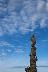 Famous plague marian column againt the blue sky in Telc, Czech republic