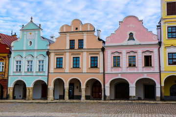 A number of colorful houses under blue sky, Telc, Czech republic