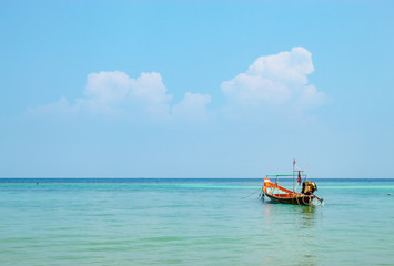 The boat moored in the sea and the beauty of the sky in summer.