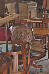 Old wood working chair In the repair shop Ferrari.