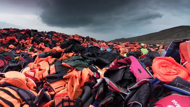 Thousands of refugee lifejackets piled up on a hillside on Lesbos, Greece