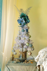 marine Christmas decoration at home, with shells, snails, nets, stones, and marine colors