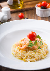 Homemade shrimp risotto served elegantly on a wooden table