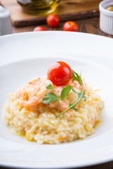 Homemade shrimp risotto served elegantly on a wooden table