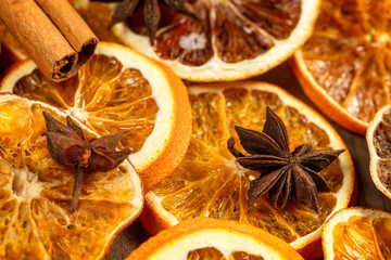 Background of dry slices of orange, cinnamon and star anise