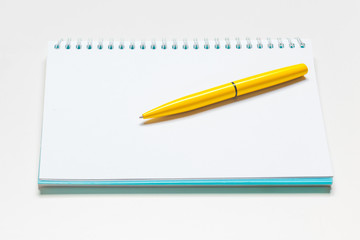 notepad notebook and ball pont pen isolated on white background