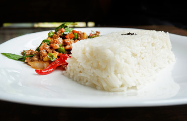 Stir fried pork basil top view / Thai Style spicy food holy basil pork fried rice recipe (Phat Kra Pow Moo)