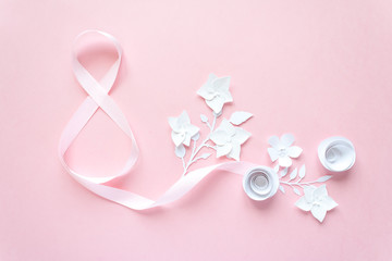 Obraz na płótnie Canvas Rose gift celebration ribbon in 8 digit shape over pink background