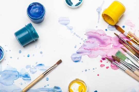 Splashes Of Watercolor Paint And Painting Supplies  Close Up