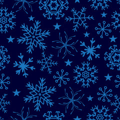 Fototapeta na wymiar Seamless pattern from snowflakes on deep blue background