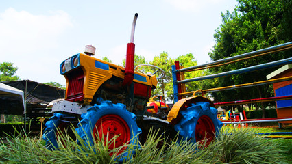 An Old Tractor Colorful / Old Vintage Tractor Colorful  stand in the garden farm - agriculture...