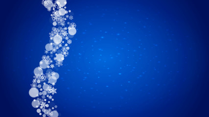 Winter border with white snowflakes for Christmas and New Year celebration. Horizontal winter border on blue background for banners, gift coupon, voucher, ads, party events. Falling frosty snowflakes.